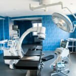 blue-modern-operating-room-with-x-ray-medical-scan-operating-table-with-special-lamp-medical-devices-research-medical-diagnosis-health-care-technology-concept