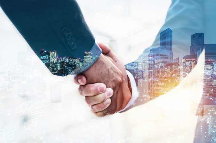 welcome-double-exposure-business-man-partner-handshake